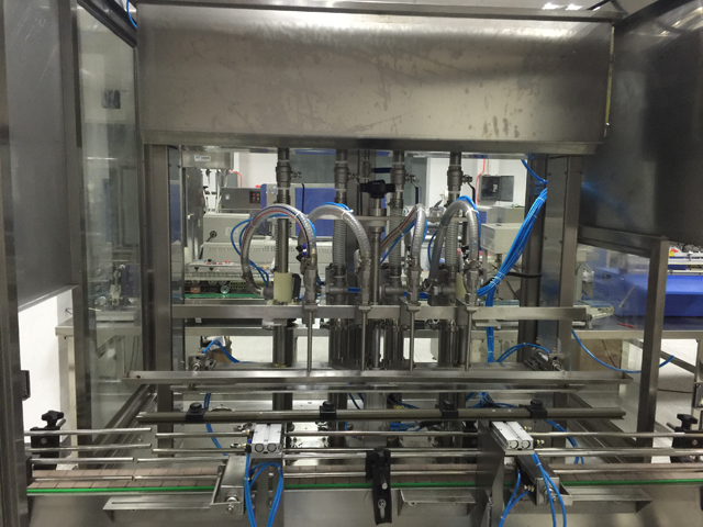 ماشین آلات پرکن چهار سر.jpg