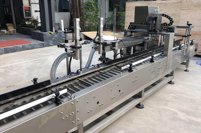 دستگاه درب سطل روغن پرکن.jpg