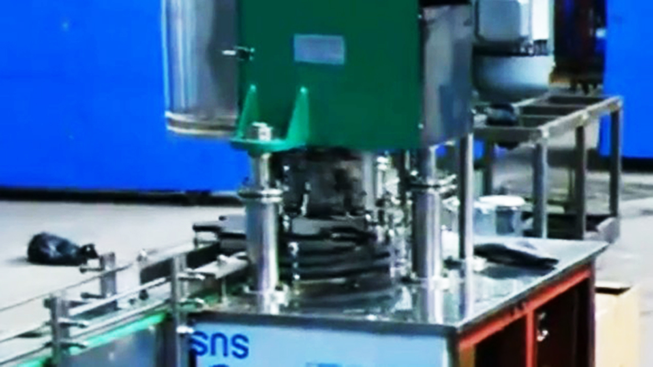 easy open cans sealing machine automatic دستگاه دربندی اتوماتیک قوطی پاپ.jpg