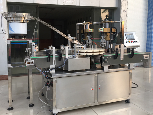 capping machine with 2 capping heads تجهیزات درپوش پیچ نیمه اتوماتیک.jpg