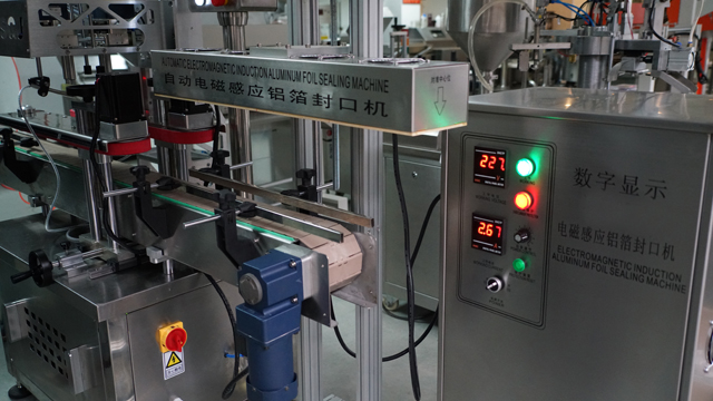 aluminum induction foil sealing machine دستگاه آب بندی اتوماتیک.jpg