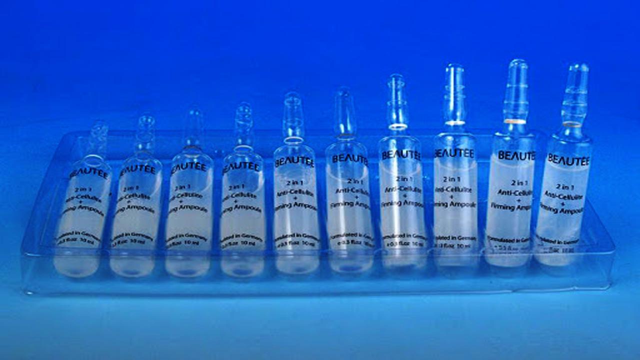 liquid solution bottles labeling machine samples final products بطری های آمپول.jpg