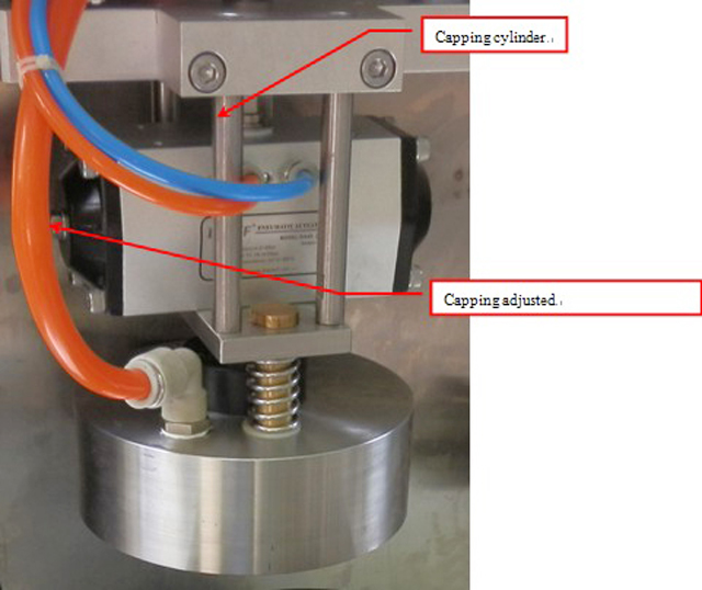 capping part from semi automatic vacuum capper سرپوش گذاری.jpg