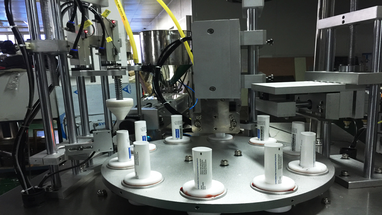 rotary filling sealing machine پر کردن دوار لوله اولتراسونیک sealing.jpg